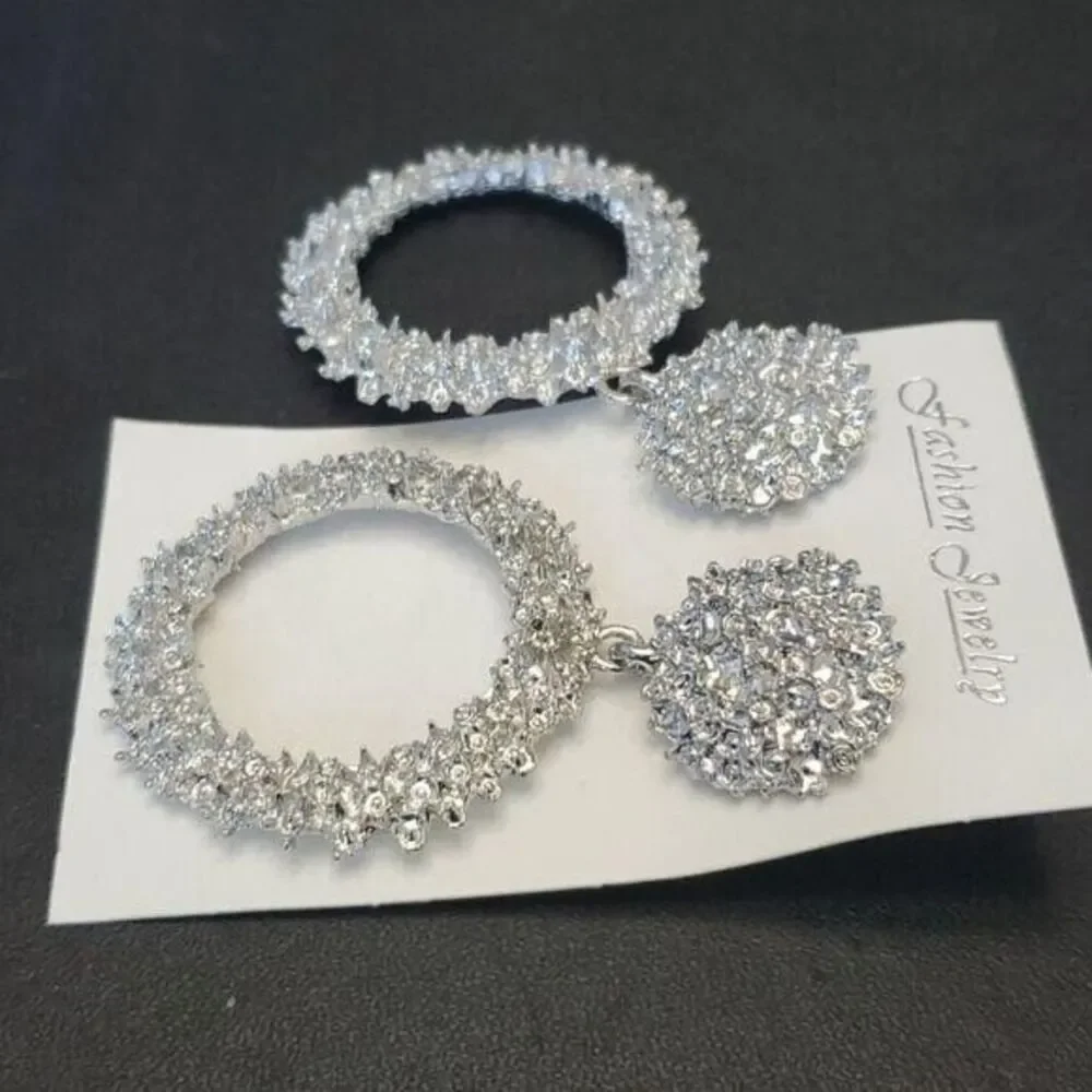 Silver tone circular themed statement earrings texture chunky